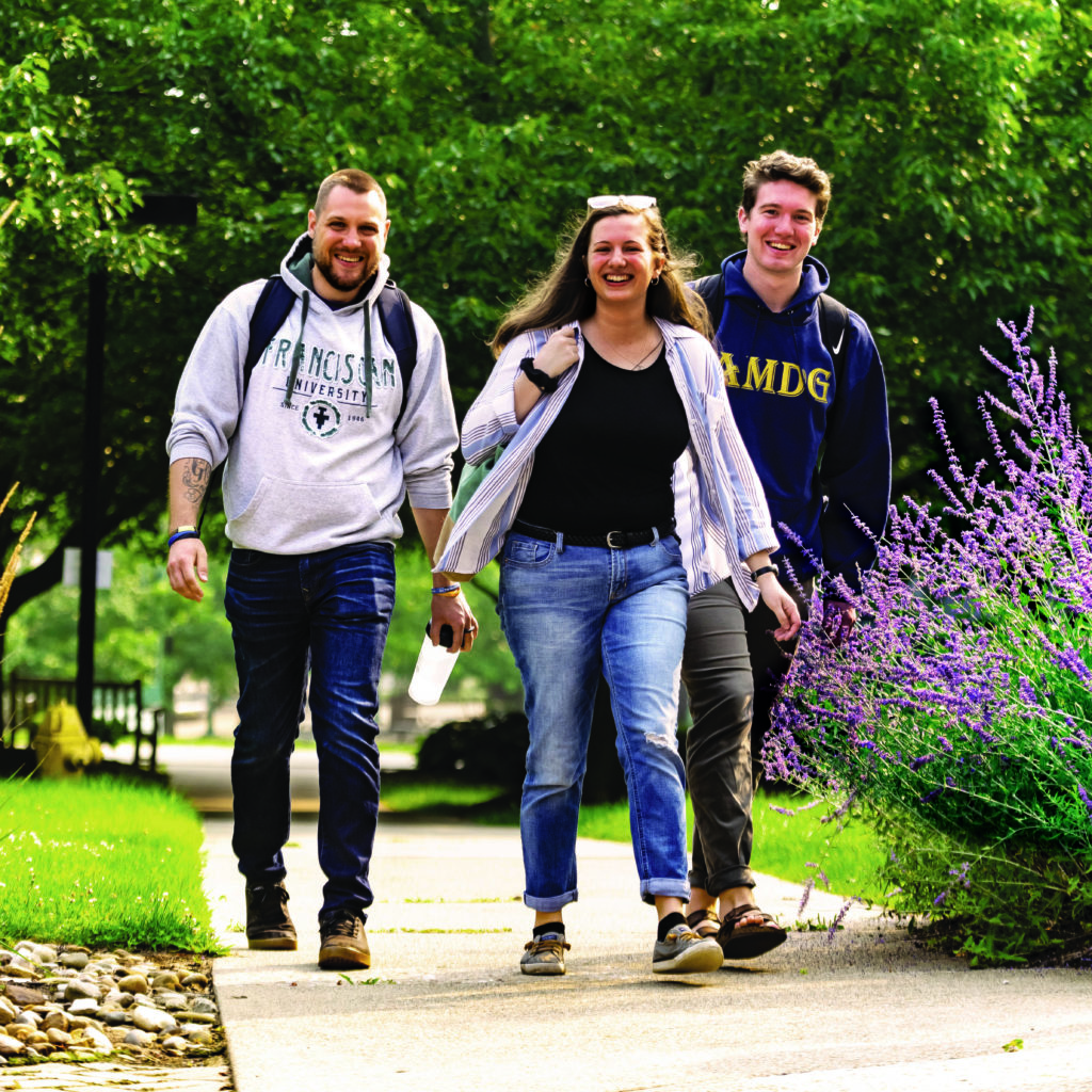 three students walking together